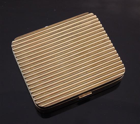 A 1940s/1950s Cartier 14ct gold and sapphire set ribbed compact, approx. 3in.